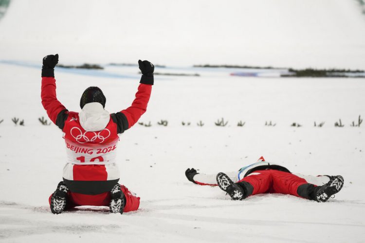 Austria takes gold in ski jumping team event